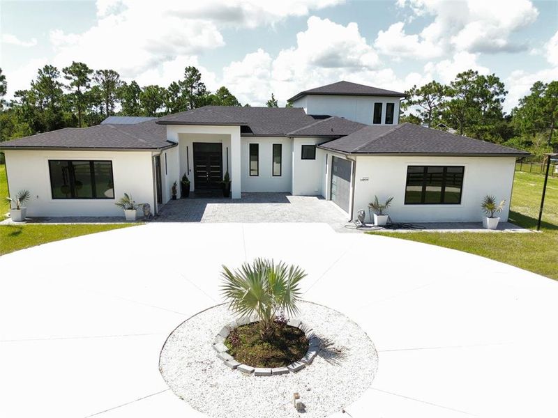 Front exterior of a new home in , Orlando, FL, highlighting curb appeal (Image 30). Front exterior of a new home in , Orlando, FL, highlighting curb appeal (Image 30).