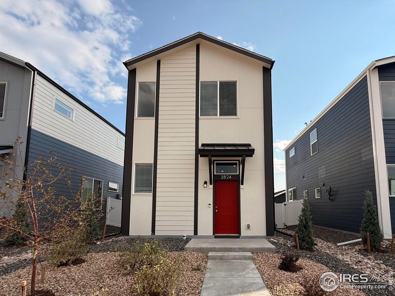 Front exterior of a new home in Liberty Draw, Evans, CO, highlighting curb appeal (Image 1). Front exterior of a new home in Liberty Draw, Evans, CO, highlighting curb appeal (Image 1).