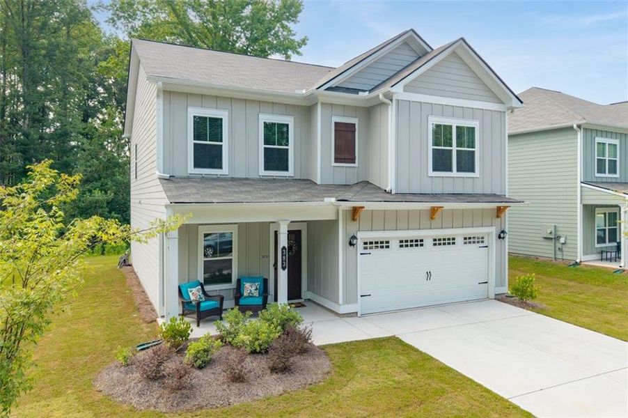 Front exterior of a new home in Morgan Landing, Carrollton, GA, highlighting curb appeal (Image 32). Front exterior of a new home in Morgan Landing, Carrollton, GA, highlighting curb appeal (Image 32).