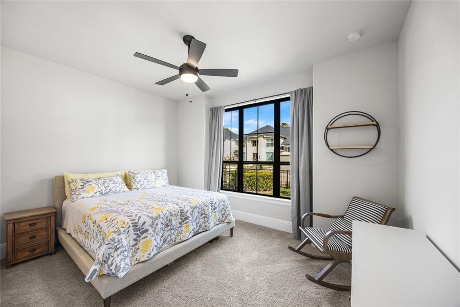 Secondary bedroom located at the front of the home with an ensuite bath.