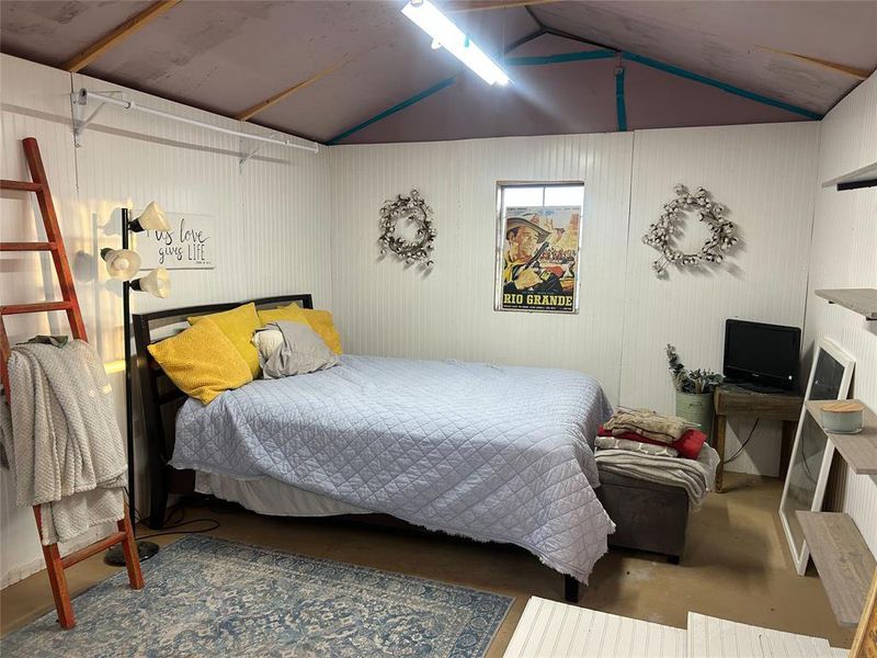 Bedroom with lofted ceiling Bedroom with lofted ceiling