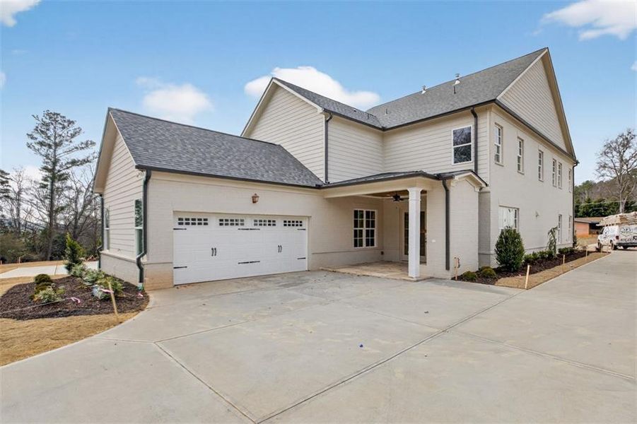 Front exterior of a new home in , Suwanee, GA, highlighting curb appeal (Image 29).