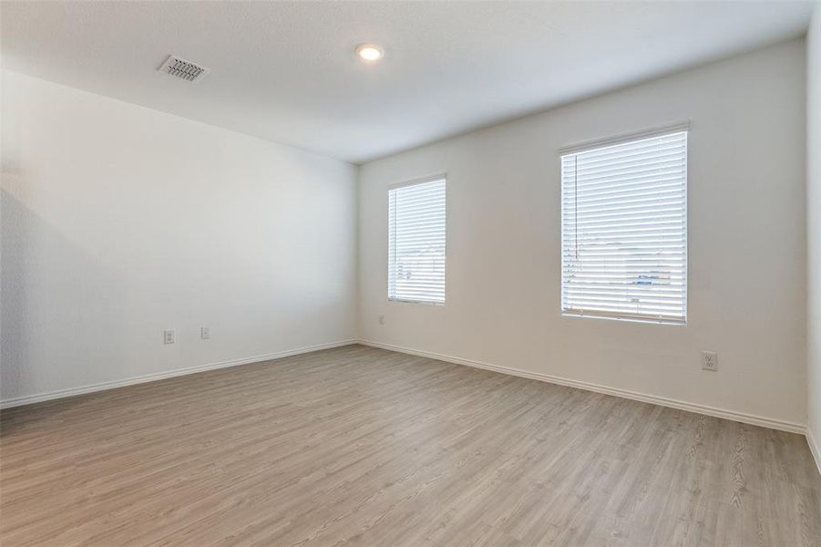 Empty room featuring light hardwood / wood-style flooring