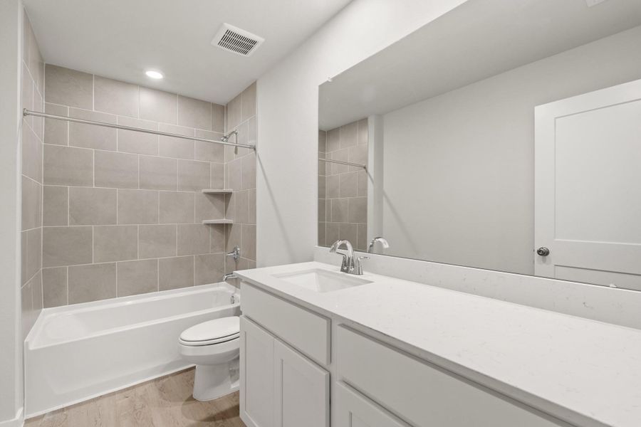 Furnished interior view inside a new home in Sunterra, Katy (Image 5).