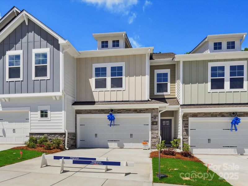 Front exterior of a new home in Westview Towns, Waxhaw, NC, highlighting curb appeal (Image 1).