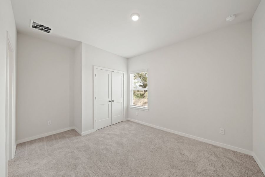 A room with white walls and a window. A room with white walls and a window.