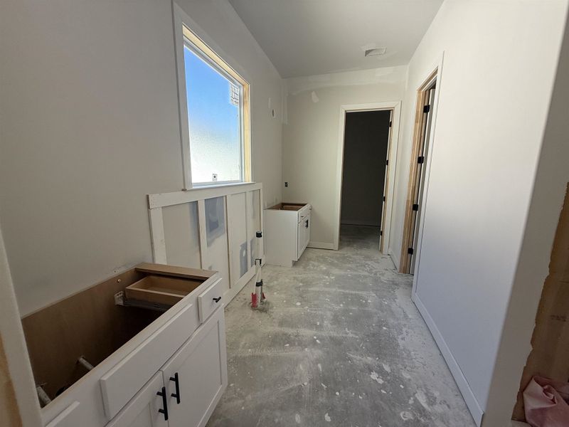 Bathroom featuring vanity and baseboards