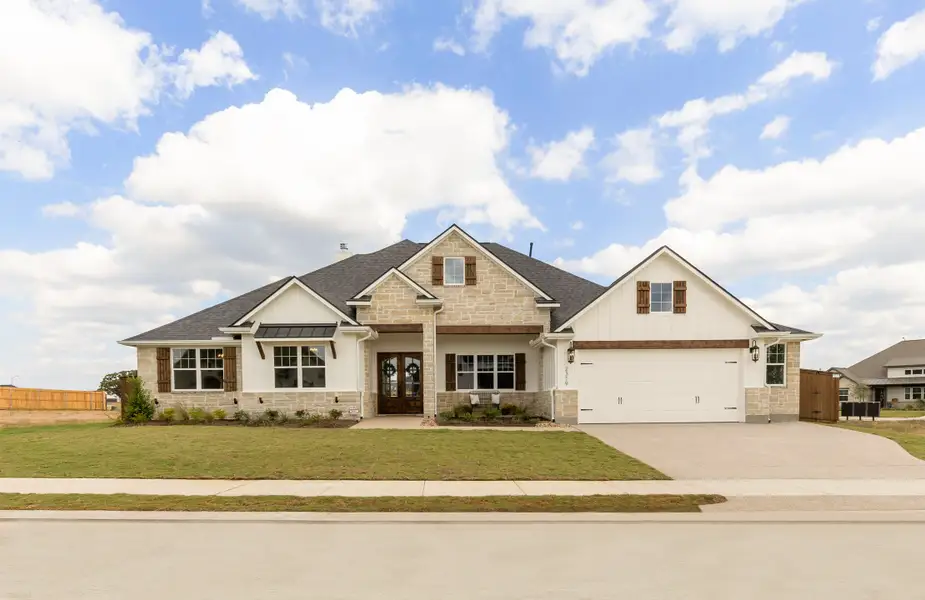 Representative exterior photo of a completed home built from the The Grayson by Reece Homes in Harvest Meadows, Bryan, TX (Image 2). Representative exterior photo of a completed home built from the The Grayson by Reece Homes in Harvest Meadows, Bryan, TX (Image 2).