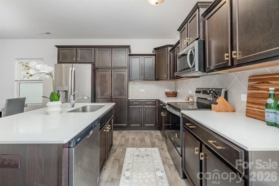 Spacious kitchen with quartz counters