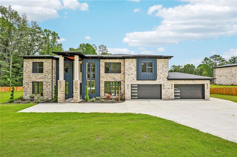 Front exterior of a new home in , Dacula, GA, highlighting curb appeal (Image 1). Front exterior of a new home in , Dacula, GA, highlighting curb appeal (Image 1).