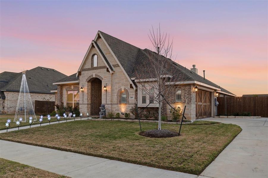 Front exterior of a new home in , Mansfield, TX, highlighting curb appeal (Image 1). Front exterior of a new home in , Mansfield, TX, highlighting curb appeal (Image 1).