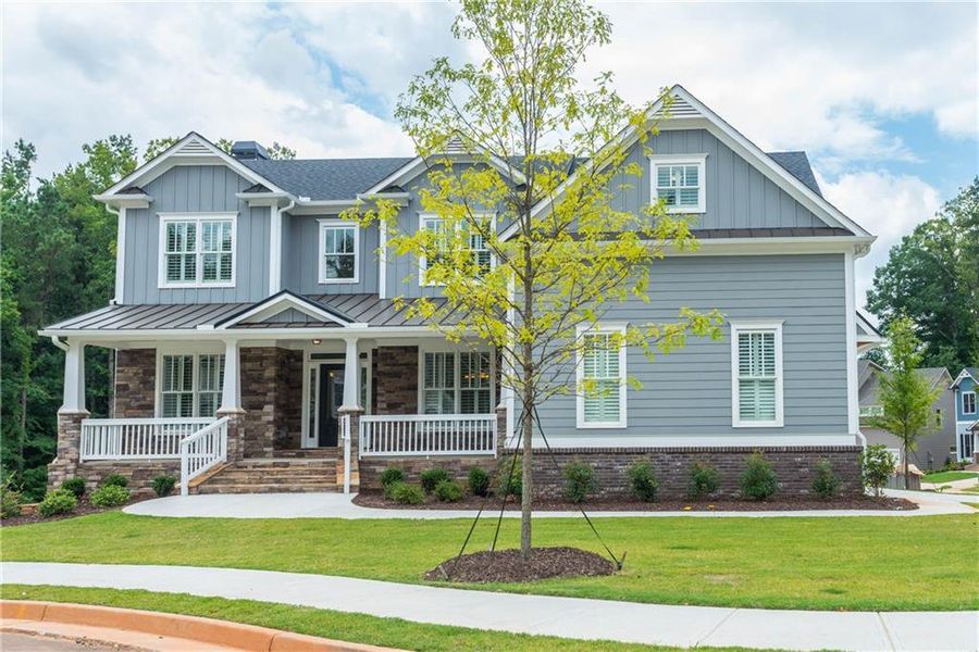 Front exterior of a new home in , Woodstock, GA, highlighting curb appeal (Image 1). Front exterior of a new home in , Woodstock, GA, highlighting curb appeal (Image 1).