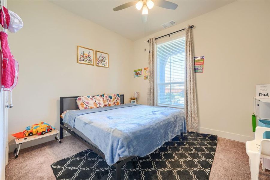 Bedroom featuring carpet flooring and ceiling fan