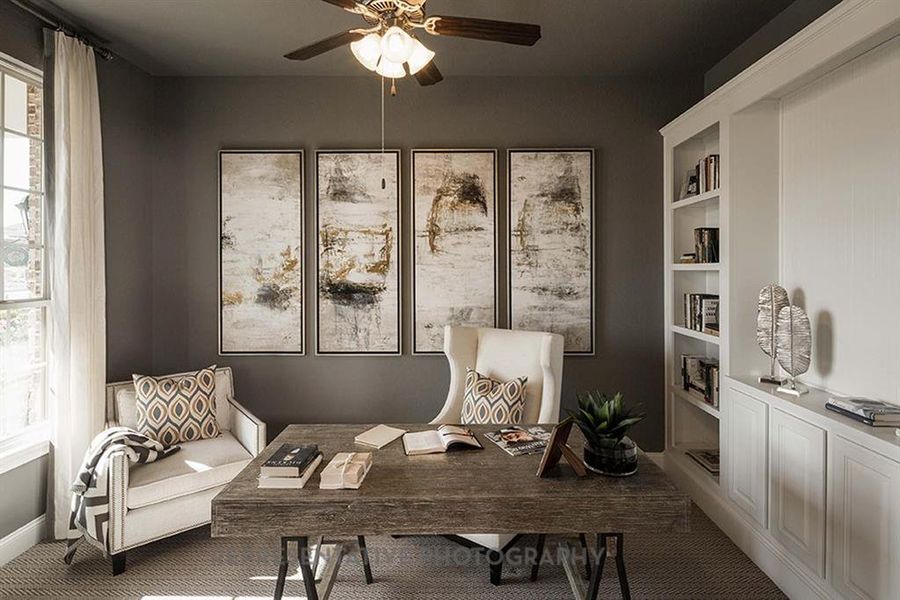 Sitting room featuring an office area, healthy amount of natural light, a ceiling fan, and carpet floors Sitting room featuring an office area, healthy amount of natural light, a ceiling fan, and carpet floors