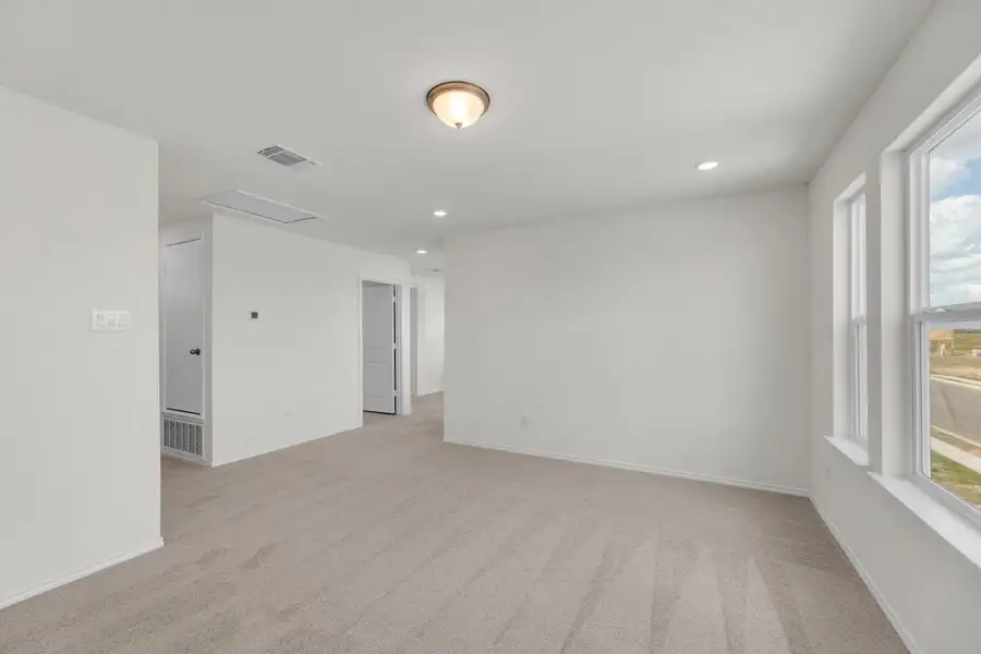 Spacious, unfurnished interior of a new home in Mustang Valley, Manor (Image 28).