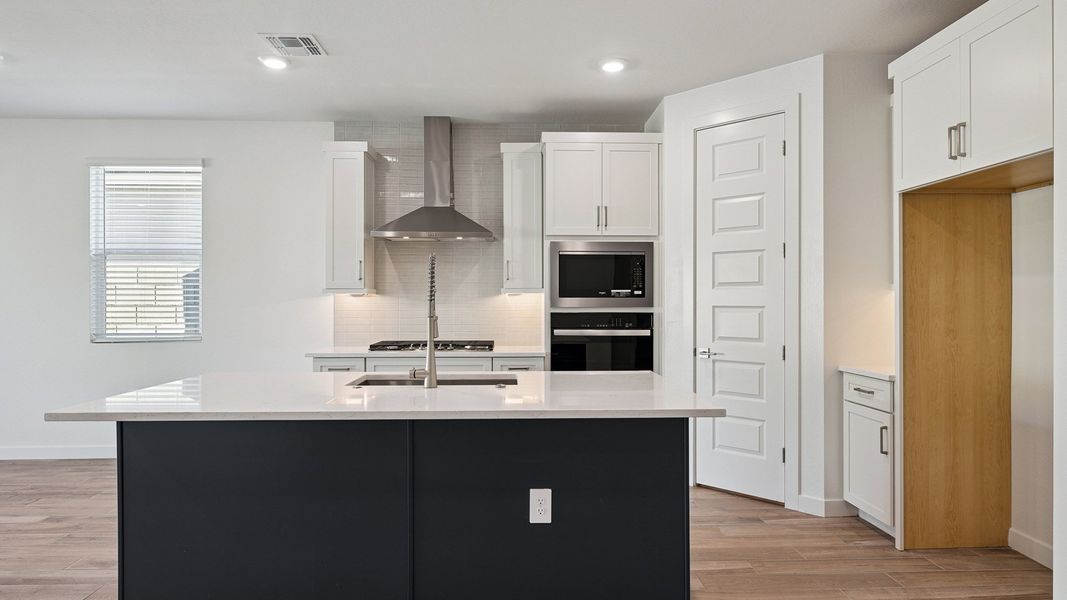 Representative furnished interior of a home built from the Hayden by D.R. Horton in The Ridge at Stone Butte, Phoenix (Image 8).