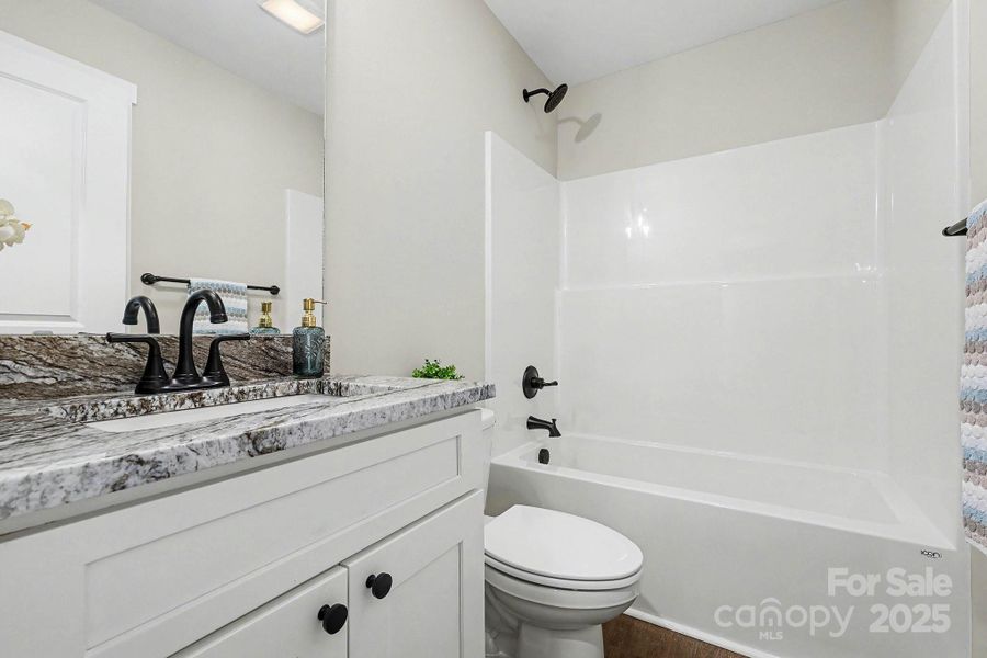 Secondary bath with granite countertop