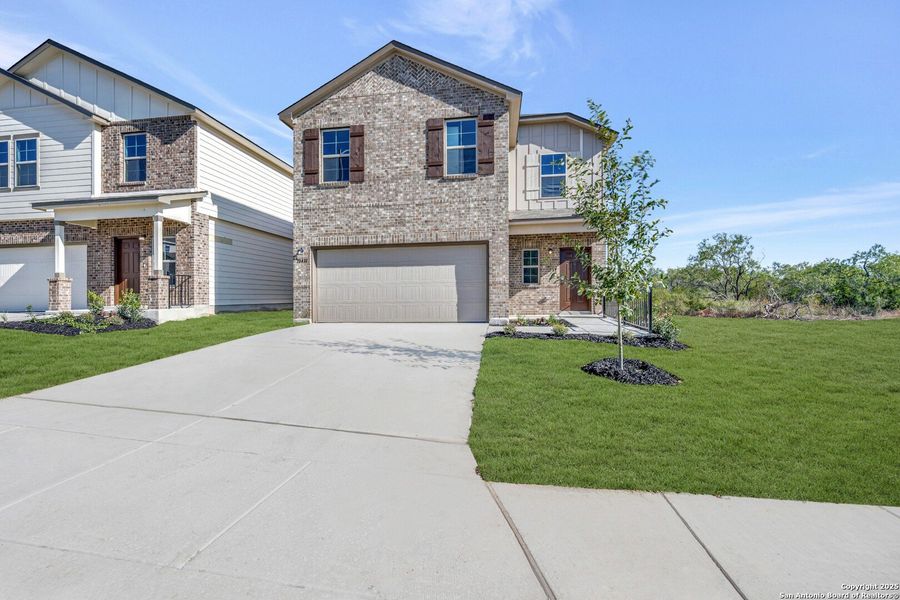 Front exterior of a new home in Paloma Park, Converse, TX, highlighting curb appeal (Image 2).