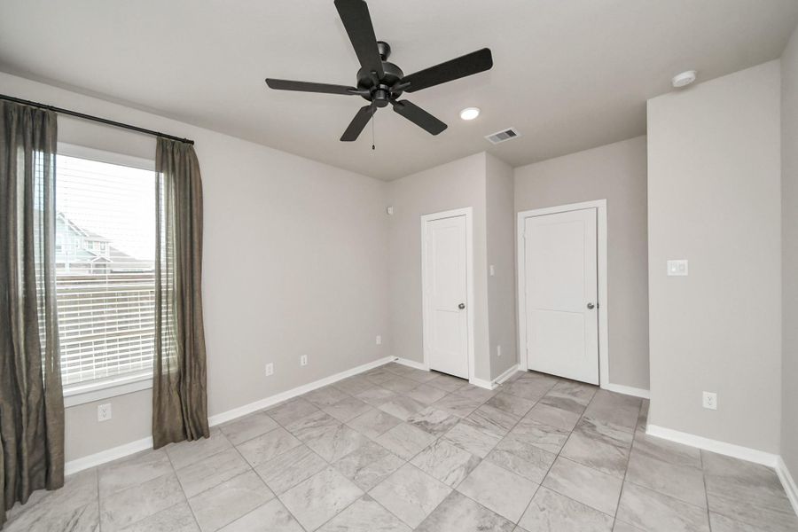 Spacious, unfurnished interior of a new home in The Groves, Humble (Image 24).