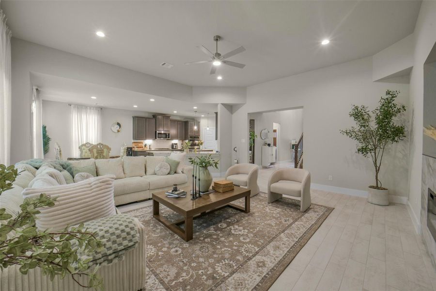 Open concept layout seamlessly connects living and kitchen spaces.