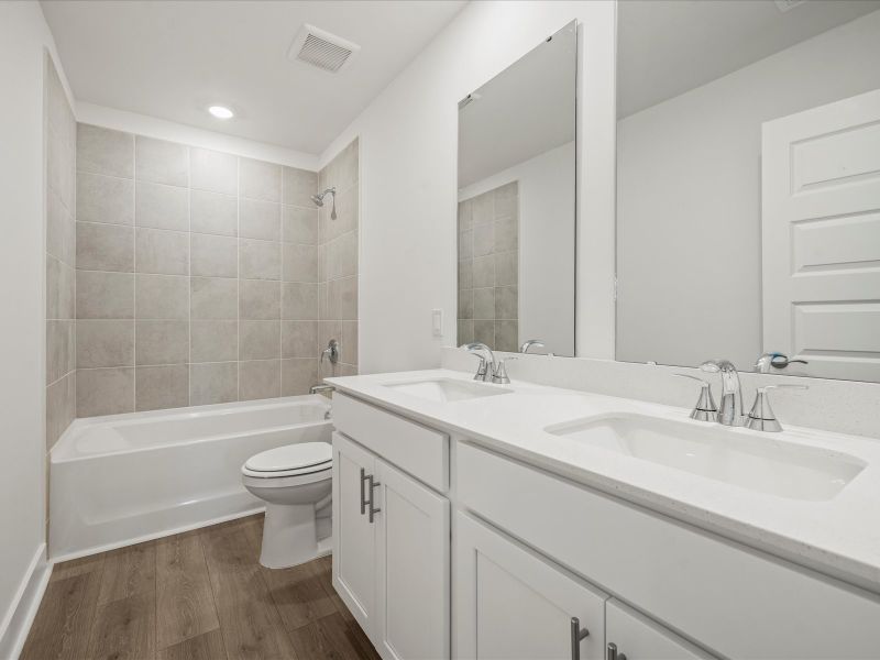 Furnished interior view inside a new home in The Coves at Lakes of Cane Bay II, Summerville (Image 10).