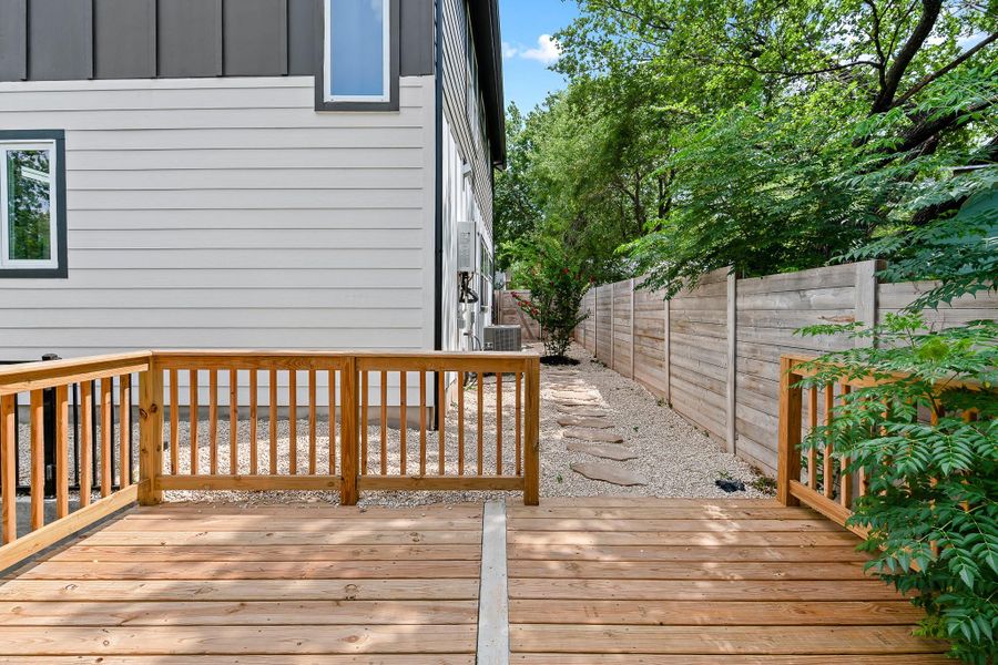 A spacious timber deck provides a tranquil outdoor retreat alongside the home.