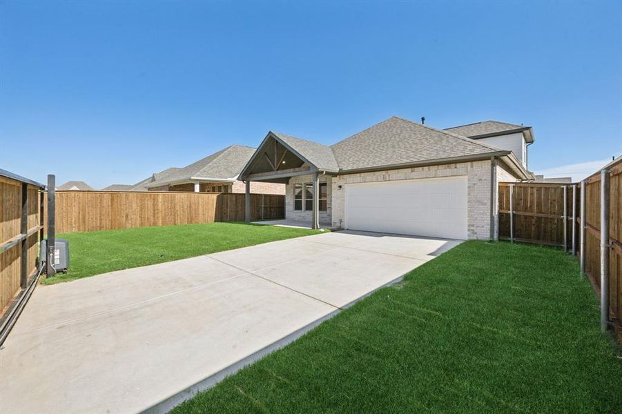 Ranch-style home with central AC unit, a garage, and a front yard