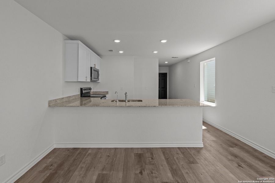 Furnished interior view inside a new home in Vista Real, Converse (Image 9).