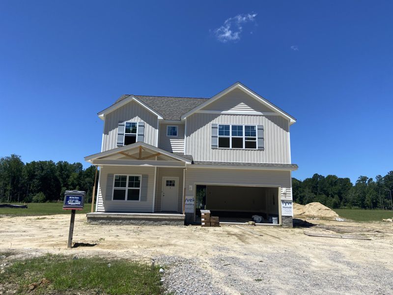 Front exterior of a new home in Laurel Oaks, Greenville, NC, highlighting curb appeal (Image 2).