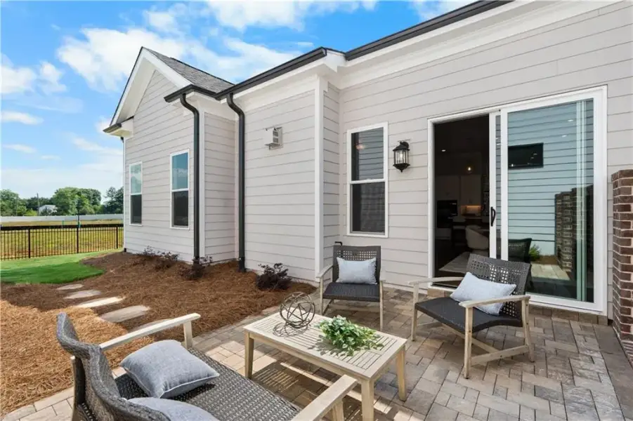Exterior details and patio area of a home in The Villas at Aberdeen, Hoschton (Image 20).