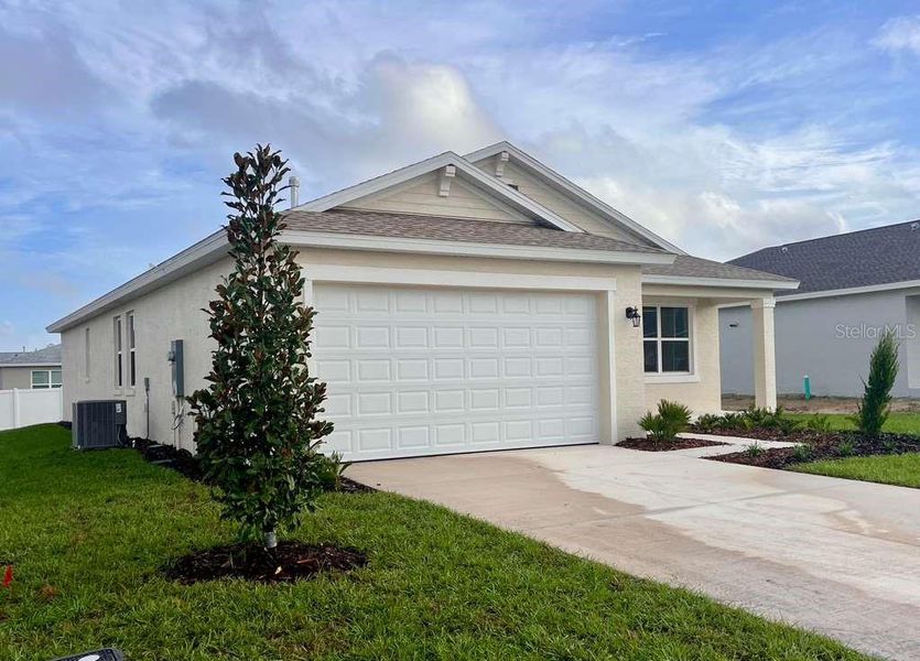 Front exterior of a new home in , Ocala, FL, highlighting curb appeal (Image 2). Front exterior of a new home in , Ocala, FL, highlighting curb appeal (Image 2).