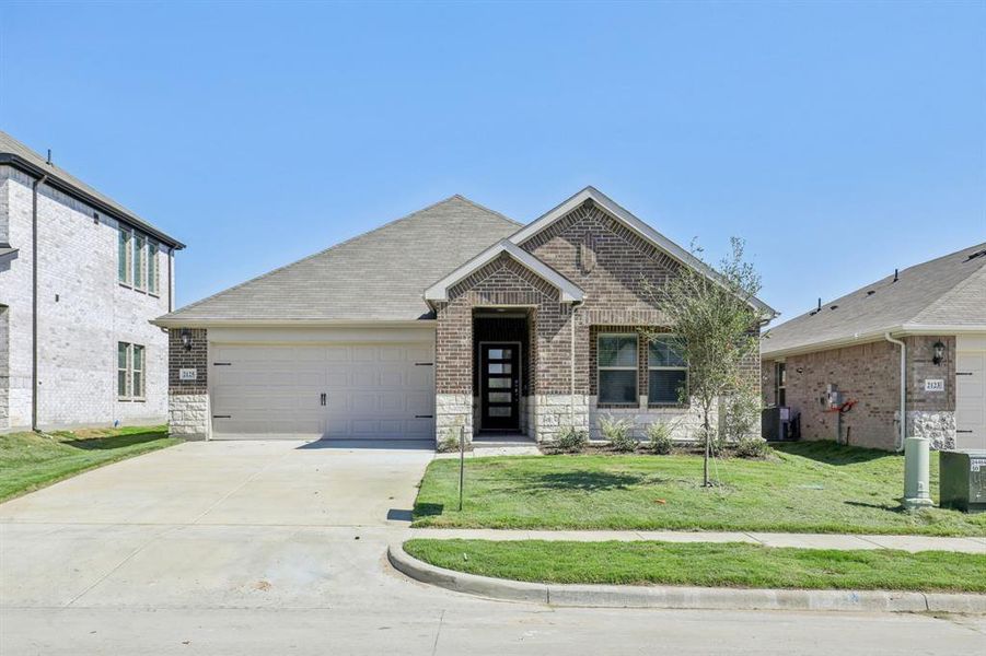 Front exterior of a new home in Stonehaven, Seagoville, TX, highlighting curb appeal (Image 1). Front exterior of a new home in Stonehaven, Seagoville, TX, highlighting curb appeal (Image 1).