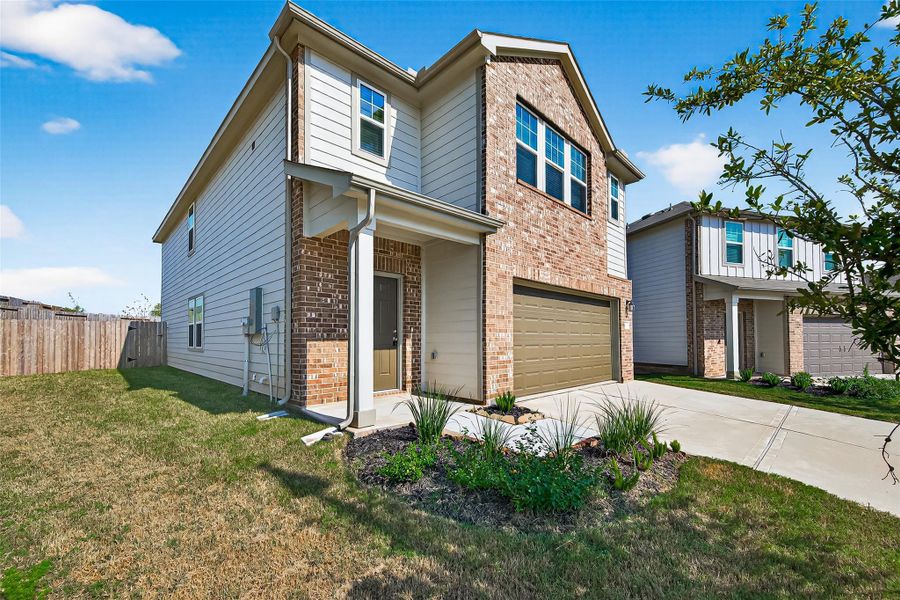 Front exterior of a new home in Chapel Run, Montgomery, TX, highlighting curb appeal (Image 2). Front exterior of a new home in Chapel Run, Montgomery, TX, highlighting curb appeal (Image 2).