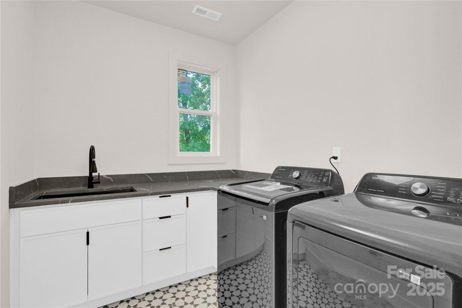 Upper level laundry with wet sink includes new smart W?D Upper level laundry with wet sink includes new smart W?D