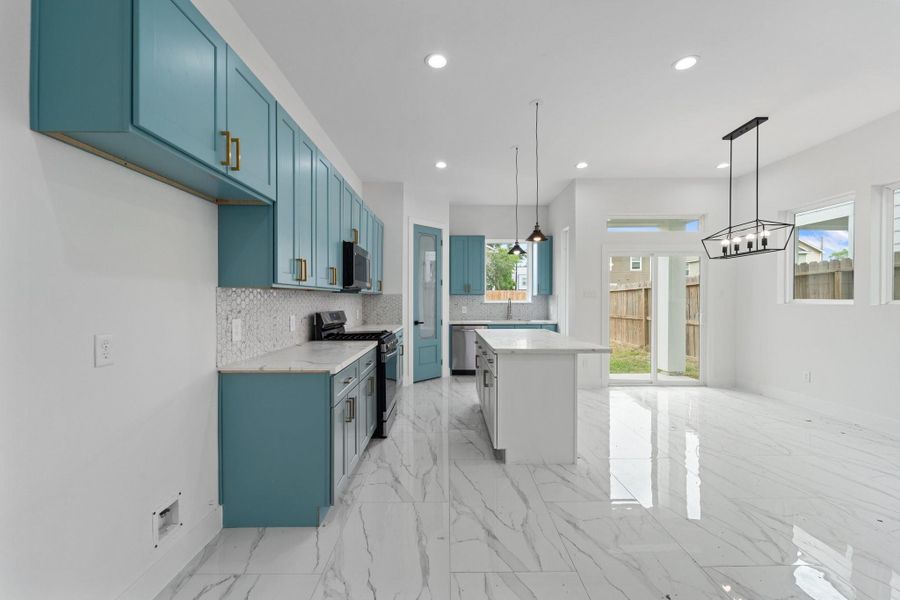 Another view of Kitchen showing space for Dining and access to covered backyard patio Another view of Kitchen showing space for Dining and access to covered backyard patio