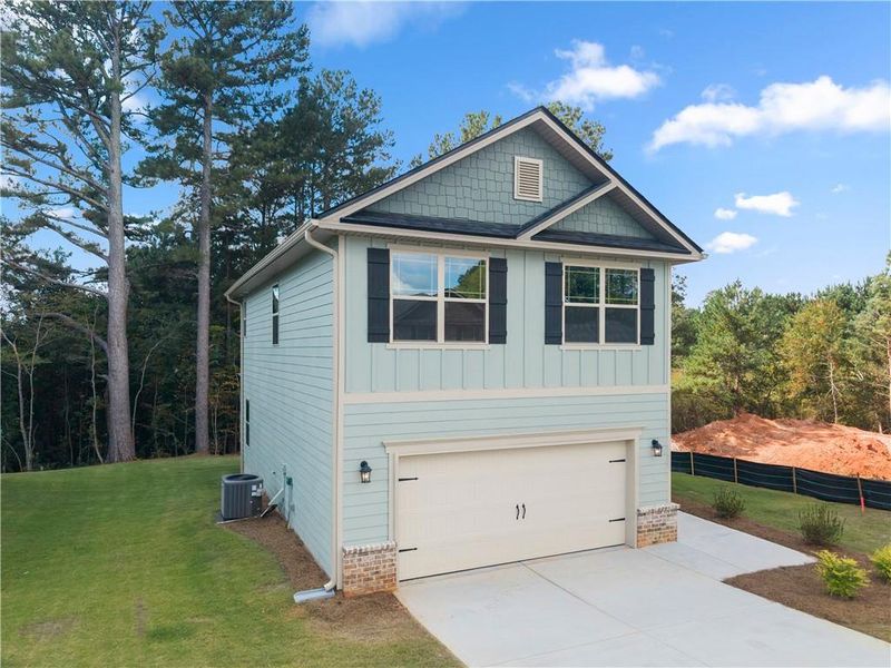 Front exterior of a new home in Magnolia Villas, Cornelia, GA, highlighting curb appeal (Image 23). Front exterior of a new home in Magnolia Villas, Cornelia, GA, highlighting curb appeal (Image 23).