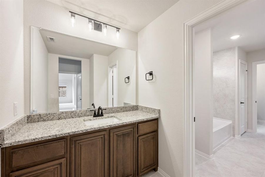 Furnished interior view inside a new home in Mockingbird Hills 60-65, Joshua (Image 14).