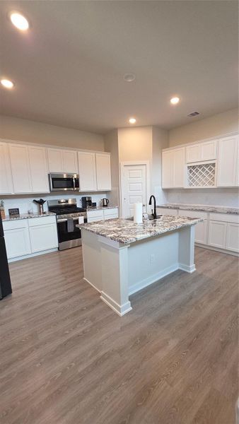Furnished interior view inside a new home in , Conroe (Image 6).