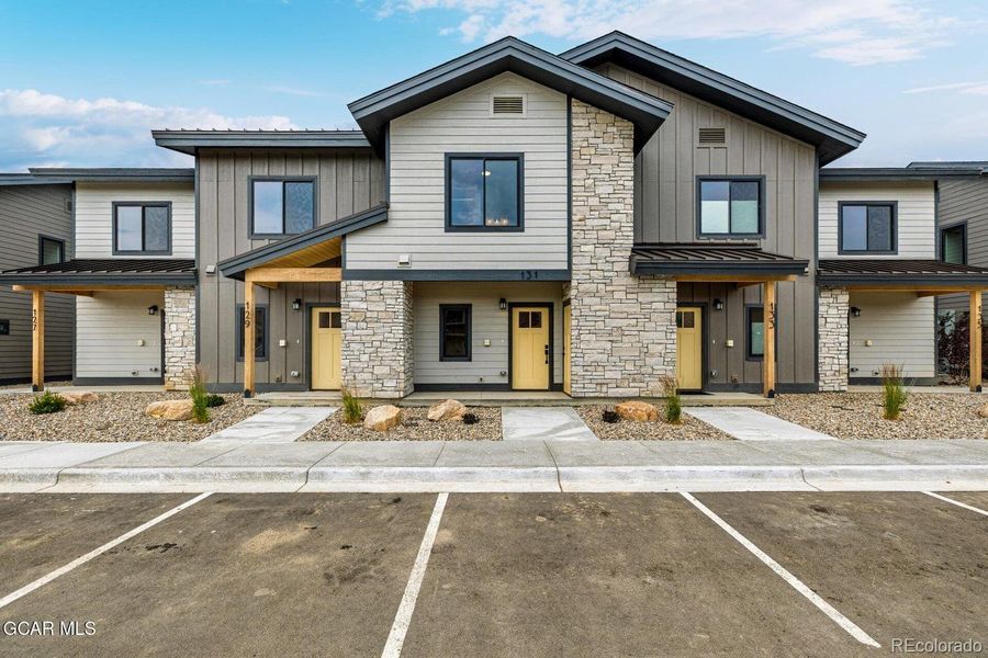 Front exterior of a new home in , Granby, CO, highlighting curb appeal (Image 27). Front exterior of a new home in , Granby, CO, highlighting curb appeal (Image 27).