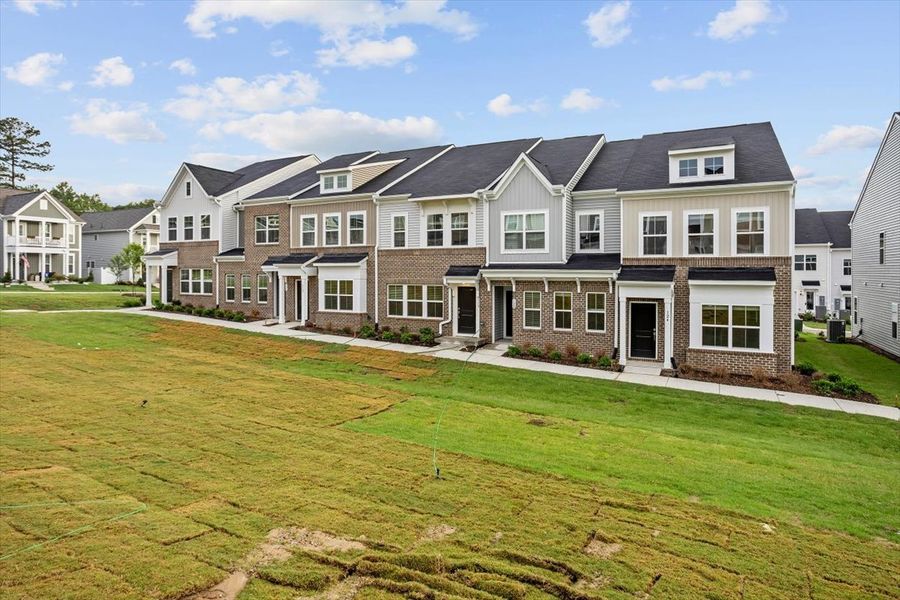 Front exterior of a new home in Renaissance at White Oak, Garner, NC, highlighting curb appeal (Image 21).
