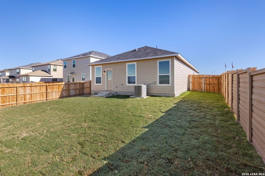 Exterior details and patio area of a home in Woodside Farms, Seguin (Image 4).