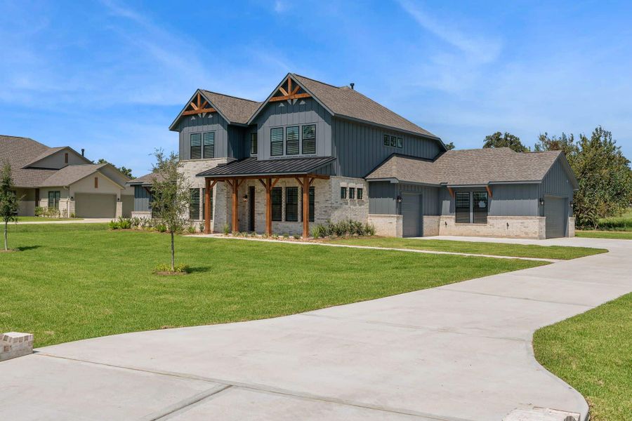 Front exterior of a new home in Chapel Bend, Montgomery, TX, highlighting curb appeal (Image 19). Front exterior of a new home in Chapel Bend, Montgomery, TX, highlighting curb appeal (Image 19).