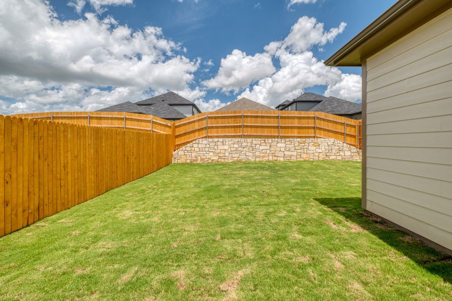 Exterior details and patio area of a home in Trinity Ranch, Elgin (Image 4).