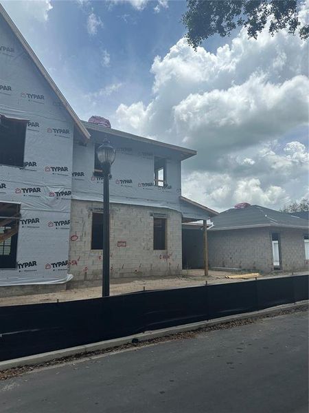 Front exterior of a new home in , Winter Garden, FL, highlighting curb appeal (Image 9).