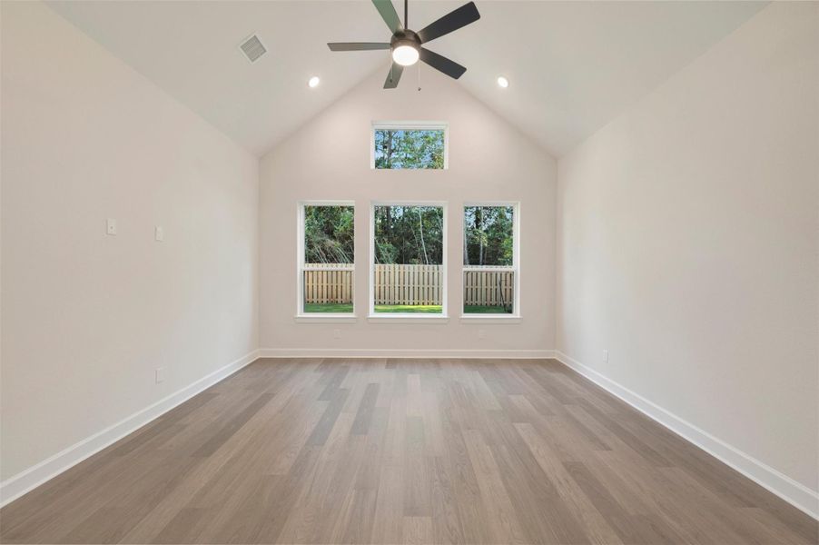 Large Master suite with cathedral ceiling and laminate floors to warm up the room!
