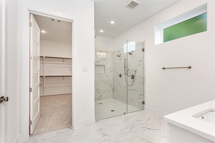Full bathroom featuring baseboards, a marble finish shower, marble finish flooring, recessed lighting, and a spacious closet