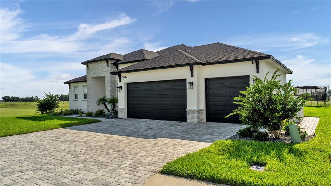 Front exterior of a new home in , Lakeland, FL, highlighting curb appeal (Image 22). Front exterior of a new home in , Lakeland, FL, highlighting curb appeal (Image 22).