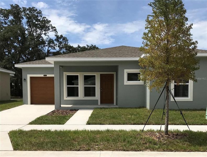 Front exterior of a new home in , Tampa, FL, highlighting curb appeal (Image 1). Front exterior of a new home in , Tampa, FL, highlighting curb appeal (Image 1).