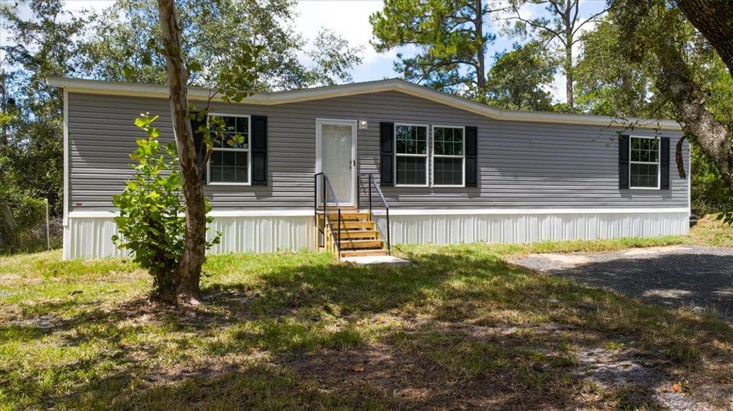 Exterior details and patio area of a home in , Bunnell (Image 2). Exterior details and patio area of a home in , Bunnell (Image 2).