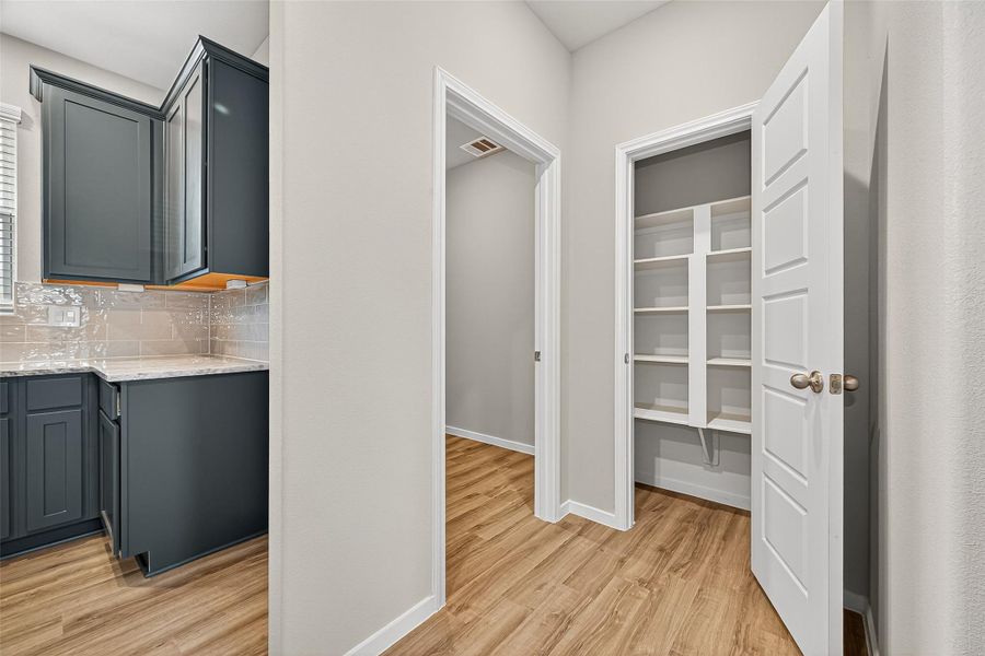 Furnished interior view inside a new home in Sunterra, Katy (Image 7).